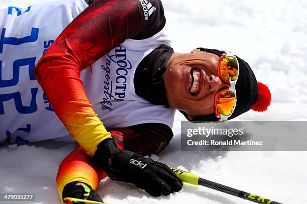 Gold medalist Andrea Eskau of Germany collapses after crossing the finish line in the Womens Cross Country 5km - Sitting on day nine of the Sochi...