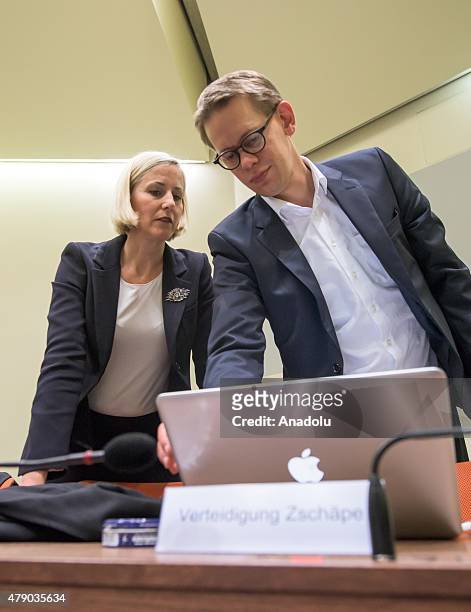 The lawyers of Co-defendant Beate Zschaepe, Wolfgang Heer and Anja Sturm , get prepared for another day of the NSU neo-Nazi murders trial on June 30,...