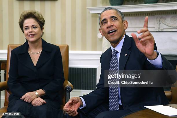 Brazilian President Dilma Rousseff and U.S. President Barack Obama pose for photographs in the Oval Office at the White House June 30, 2015 in...