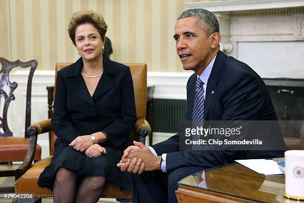 Brazilian President Dilma Rousseff and U.S. President Barack Obama pose for photographs in the Oval Office at the White House June 30, 2015 in...