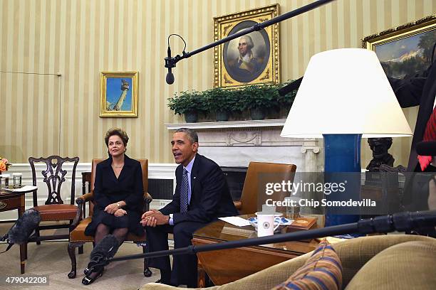 Brazilian President Dilma Rousseff and U.S. President Barack Obama pose for photographs in the Oval Office at the White House June 30, 2015 in...