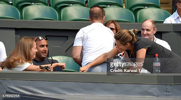 Kim Murray and Amelie Mauresmo attend the Mikhail Kukushkin v Andy Murray match on day two of the Wimbledon Tennis Championships at Wimbledon on June...