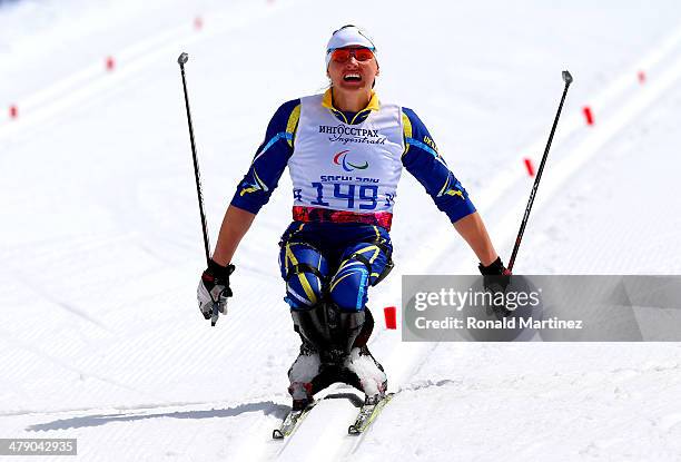 Silver medalist Lyudmyla Pavlenko of Ukraine crosses the finish line in the Womens Cross Country 5km - Sitting on day nine of the Sochi 2014...