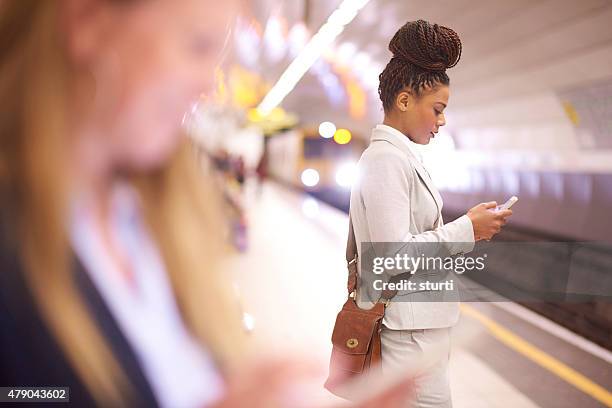 female commuter in the subway - modern traveling stock pictures, royalty-free photos & images
