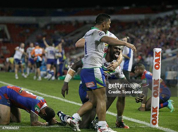 Edrick Lee of the Raiders celebrates a try with team mates during the round two NRL match between the Newcastle Knights and the Canberra Raiders at...