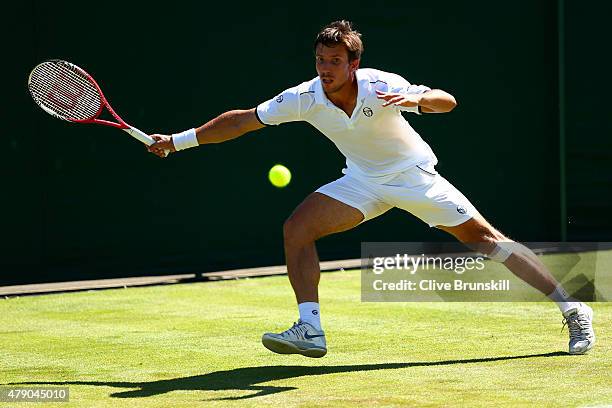Igor Sijsling of Netherlands in action in his Gentlemens Singles first round match against Sam Querry of the United States during day two of the...