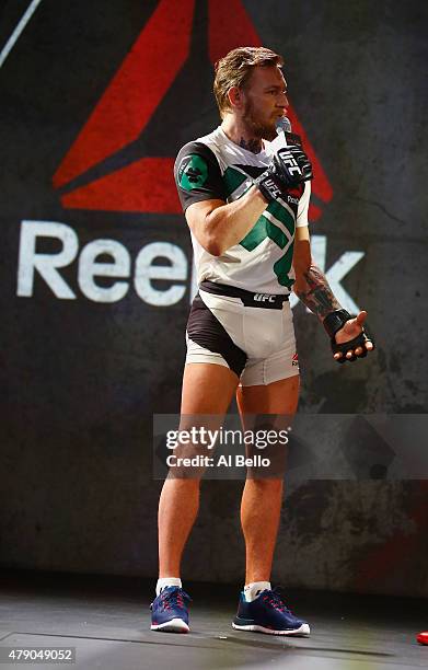 Fighter Conor McGregor shows the new Reebok clothing line during the Reebok Fight Kit Launch at Skylight Modern on June 30, 2015 in New York City.