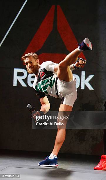 Fighter Conor McGregor shows the new Reebok clothing line during the Reebok Fight Kit Launch at Skylight Modern on June 30, 2015 in New York City.