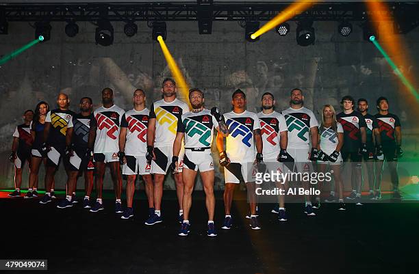 Fighters display the new Reebok clothing line during the Reebok Fight Kit Launch at Skylight Modern on June 30, 2015 in New York City.