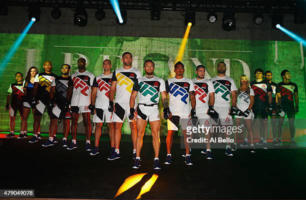 Fighters display the new Reebok clothing line during the Reebok Fight Kit Launch at Skylight Modern on June 30, 2015 in New York City.