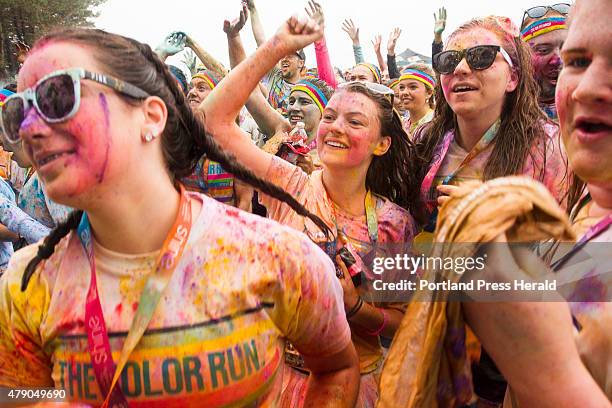 Julia Lihzis, Emily Franks, Kaylee Magnuson and Sarah McNamara, all 14 of Mashpee, Mass, join in on the festivities after the 5K Color Run in South...