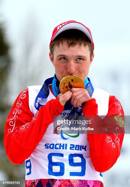 Gold medalist Aleksandr Pronkov of Russia poses during the medal ceremony for the Mens Cross Country 10km Free  Standing on day nine of the Sochi...