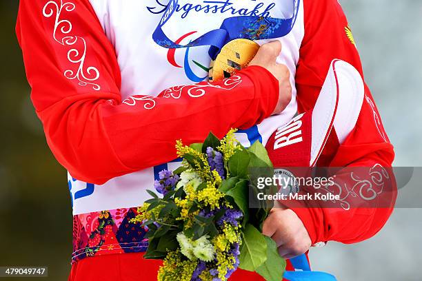 Gold medalist Aleksandr Pronkov of Russia poses during the medal ceremony for the Mens Cross Country 10km Free  Standing on day nine of the Sochi...