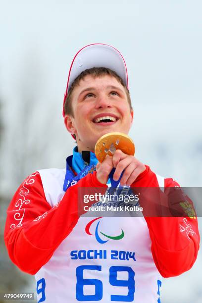 Gold medalist Aleksandr Pronkov of Russia poses during the medal ceremony for the Mens Cross Country 10km Free  Standing on day nine of the Sochi...