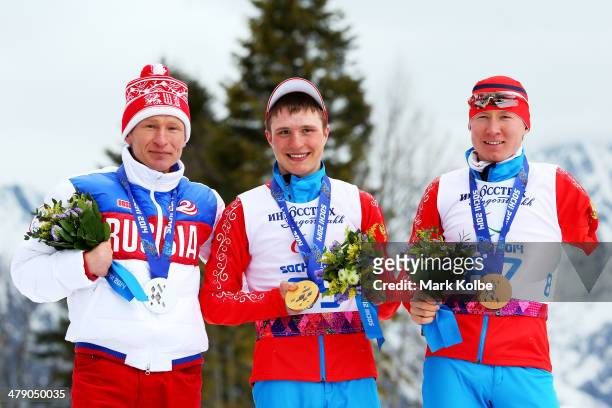 Silver medalist Vladimir Kononov of Russia, gold medalist Aleksandr Pronkov of Russia and bronze medalist Vladislav Lekomtcev of Russia pose during...