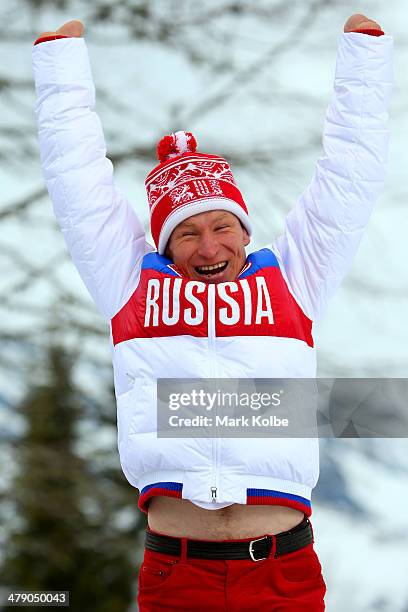 Silver medalist Vladimir Kononov of Russia celebrates during the medal ceremony for the Mens Cross Country 10km Free  Standing on day nine of the...