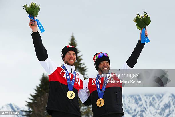 Gold medalist Brian McKeever of Canada and guide Erik Carleton pose during the medal ceremony for the Mens Cross Country 10km Free  Visually...