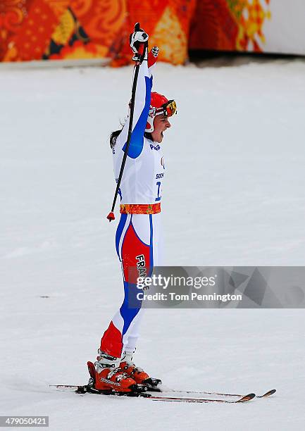 Marie Bochet of France celebrates winning the gold medal in the Women's Giant Slalom Standing during day nine of the Sochi 2014 Paralympic Winter...