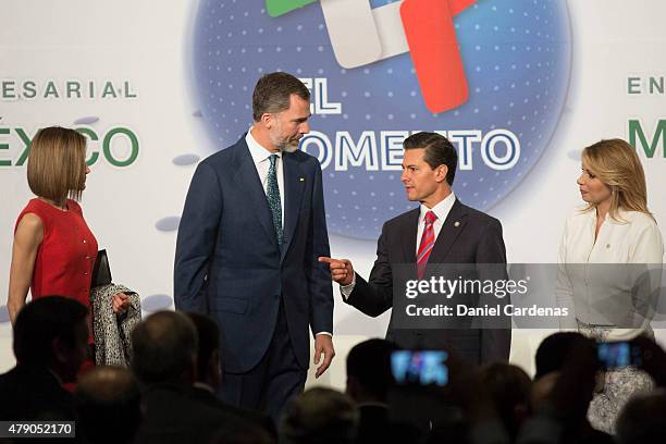 King Felipe VI and President of Mexico Enrique Peña Nieto talk during the Business Forum at Presidente Hotel on June 30, 2015 in Mexico City, Mexico....