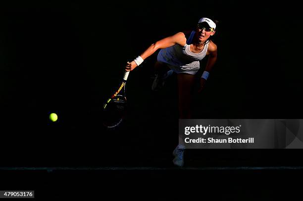 Saisai Zheng of China in action in her Ladies Singles first round match against Caroline Wozniacki of Denmark during day two of the Wimbledon Lawn...