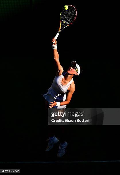 Saisai Zheng of China in action in her Ladies Singles first round match against Caroline Wozniacki of Denmark during day two of the Wimbledon Lawn...