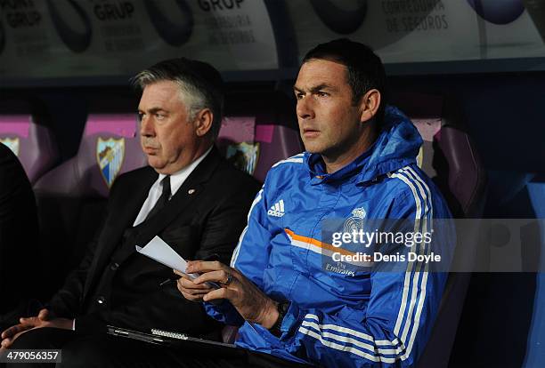 Assistant coach Paul Clement sits beside head coach Carlo Ancelotti of Real Madrid FC during the La Liga match between Malaga and Real Madrid at La...