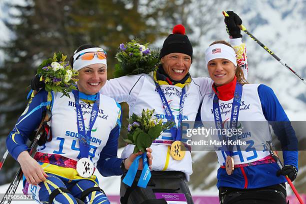 Silver medalist Lyudmyla Pavlenko of Ukraine, gold medalist Andrea Eskau of Germany and bronze medalist Oksana Masters of the United States pose...