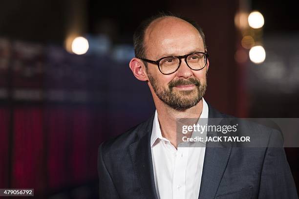 British producer James Gay-Rees poses on the red carpet at the premiere of the film Amy in central London on June 30, 2015. The documentary, which...