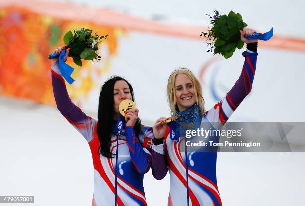 Henrieta Farkasova of Slovakia celebrates winning the gold medal with her guide Natalia Subrtova during the medal ceremony for the Women's Giant...