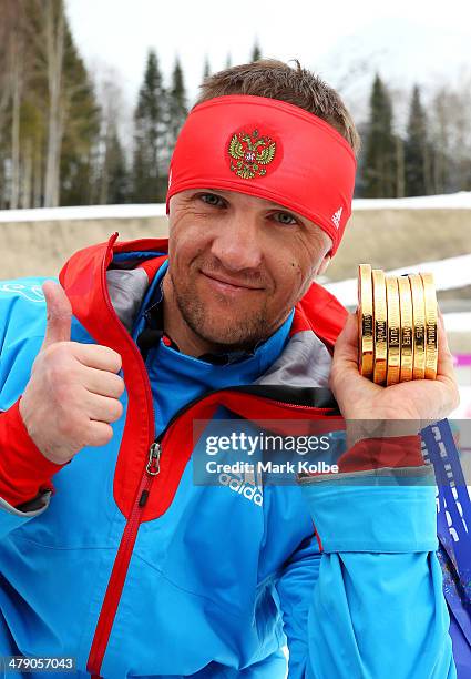 Roman Petushkov of Russia poses with the six gold medals won during the Sochi 2014 Paralympic Winter Games at Laura Cross-country Ski and Biathlon...