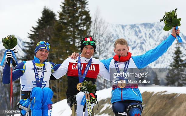 Silver medalist Maksym Yarovyi of Ukraine, gold medalist Chris Klebl of Canada and bronze medalist Grigory Murygin of Russia pose during the medal...