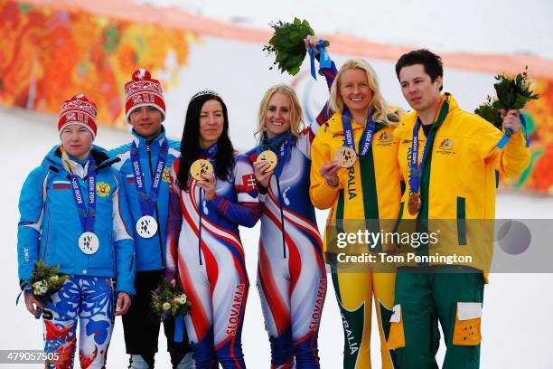Henrieta Farkasova of Slovakia celebrates winning the gold medal with her guide Natalia Subrtova, silver medalists Aleksandra Frantceva of Russia and...