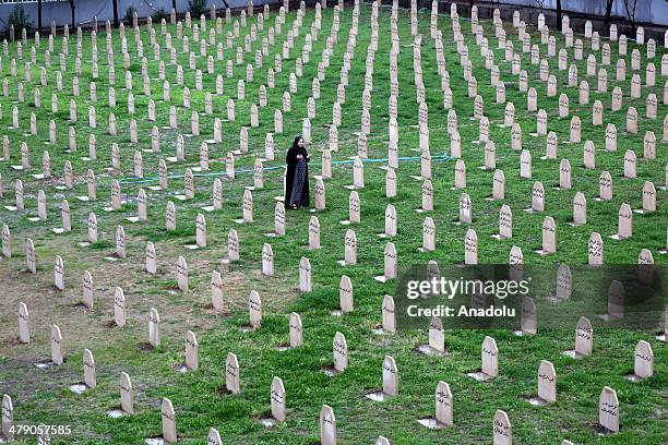 People visit their relatives who died at Halabja chemical attack in Sulaymaniyah, Iraq on March 16, 2014. Halabja chemical attack lasted only for few...
