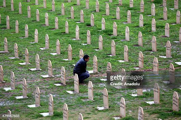 People visit their relatives who died at Halabja chemical attack in Sulaymaniyah, Iraq on March 16, 2014. Halabja chemical attack lasted only for few...