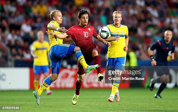 Oscar Lewicki of Sweden and Bernardo Silva of Portugal battle for the ball during the UEFA European Under-21 final match between Sweden and Portugal...