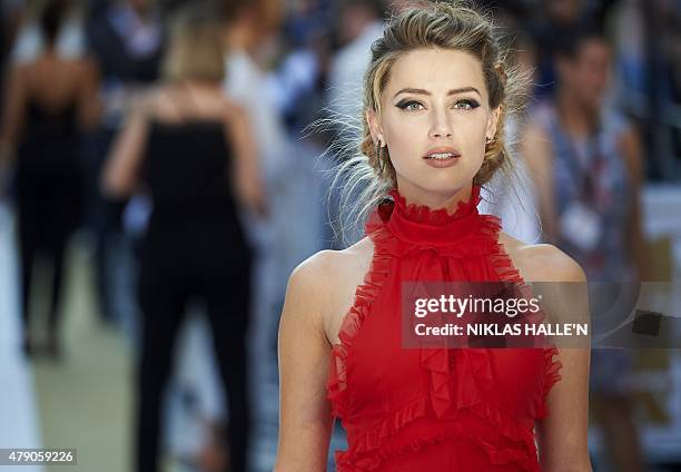 Actress Amber Heard arrives for the European premiere of Magic Mike XXL in central London on June 30, 2015. AFP PHOTO / NIKLAS HALLE'N