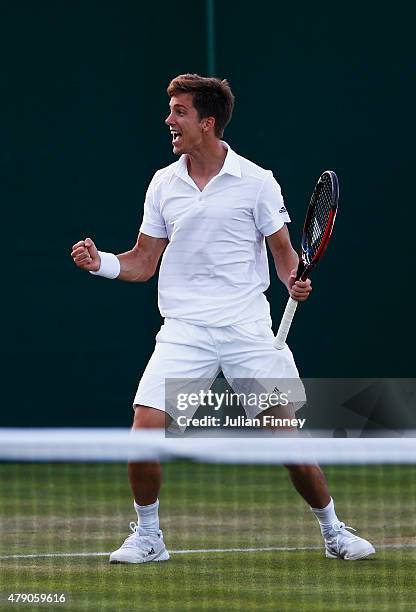 Aljaz Bedene of Great Britain celebrates winning his Gentlemens Singles first round match against Radek Stepanek of the Czech Republic during day two...