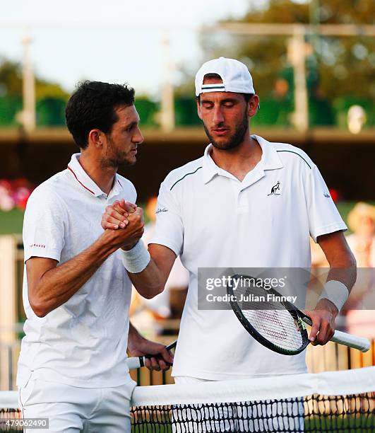 James Ward of Great Britain shakes hands with his opponent after winning his Gentlemens Singles first round match against Luca Vanni of Italy during...