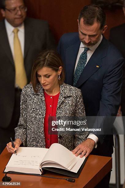 Queen Letizia and King Felipe VI of Spain , sign the guestbook after a speech aimed to the members of Mexican Senate at Senate on June 30, 2015 in...