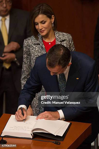 Queen Letizia and King Felipe VI of Spain , sign the guestbook after a speech aimed to the members of Mexican Senate at Senate on June 30, 2015 in...