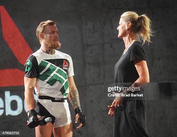 Fighter Conor McGregor and Reebok design expert Corinna Werkle speak at the Launch Of The Reebok UFC Fight Kit at Skylight Modern on June 30, 2015 in...
