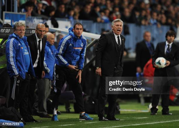 Head coach Carlo Ancelotti of Real Madrid gestures beside his assistants Paul Clement , Zinedine Zidane and Giovanni Mauri during the La Liga match...