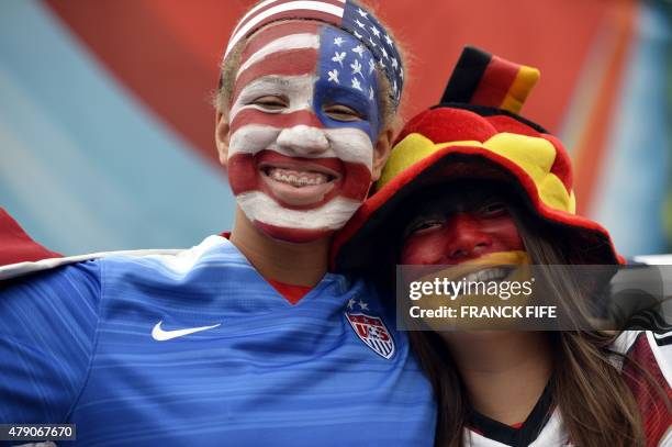 And Germany supporters pose before the semifinal football match between USA and Germany during their 2015 FIFA Women's World Cup at the Olympic...