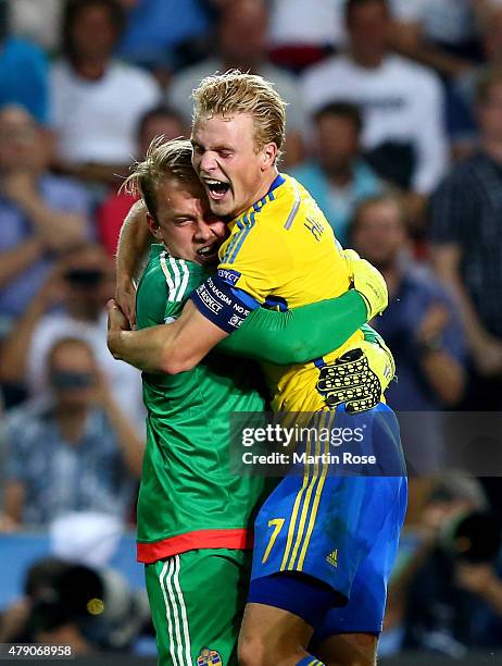 Patrik Carlgren , goalkeeper of Sweden celebrate with team mate Oscar Hiljemark after penalty shoot out during the UEFA European Under-21 final match...