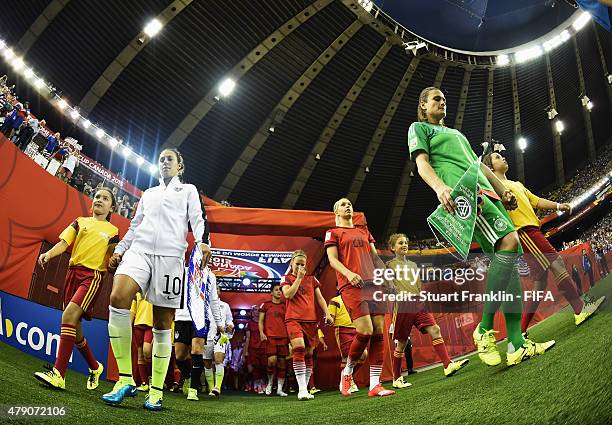 The players of Germany and USA come onto the pitch during the FIFA Women's World Cup Semi Final match between USA and Germany at Olympic Stadium on...