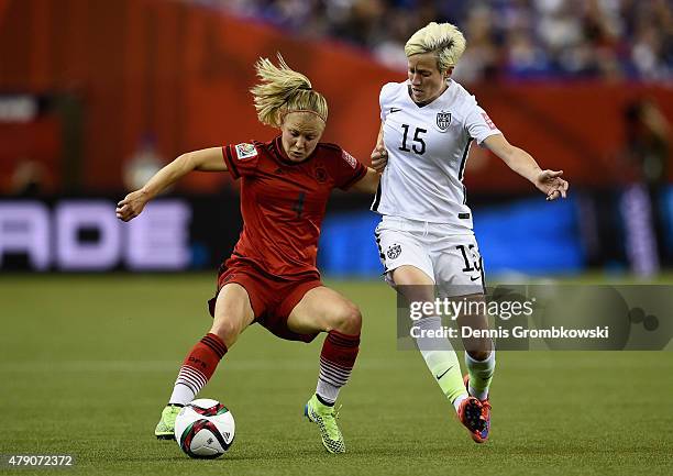 Leonie Maier of Germany and Megan Rapinoe of the United States battle for the ball in the FIFA Women's World Cup 2015 Semi-Final Match at Olympic...