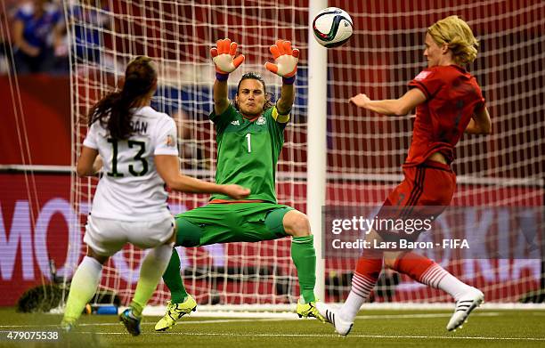 Goalkeeper Nadine Angerer of Germany saves a shot of Alex Morgan of USA during the FIFA Women's World Cup 2015 Semi Final match between USA and...