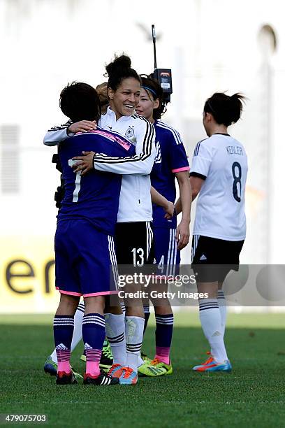 Celia Sasic of Germany greeting Kozue Ando of Japan at the end of the Algarve Cup final match between Germany and Japan on March 12, 2014 in Faro,...