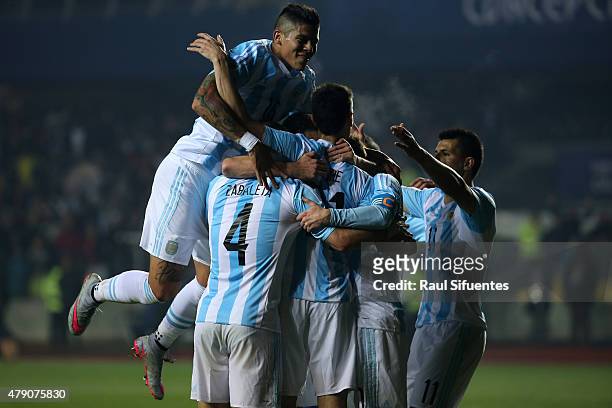 Javier Pastore of Argentina celebrates with teammates after scoring the second goal of his team during the 2015 Copa America Chile Semi Final match...
