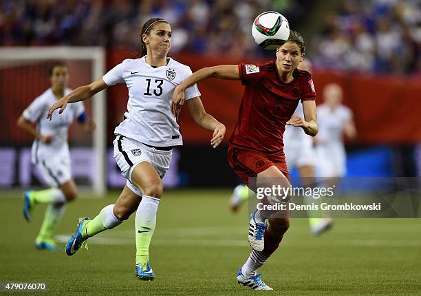 Alex Morgan of the United States and Annike Krahn of Germany battle for the ball in the FIFA Women's World Cup 2015 Semi-Final Match at Olympic...